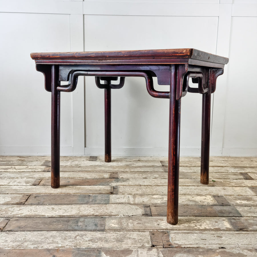 Antique Chinese table with deep burgundy lacquered finish