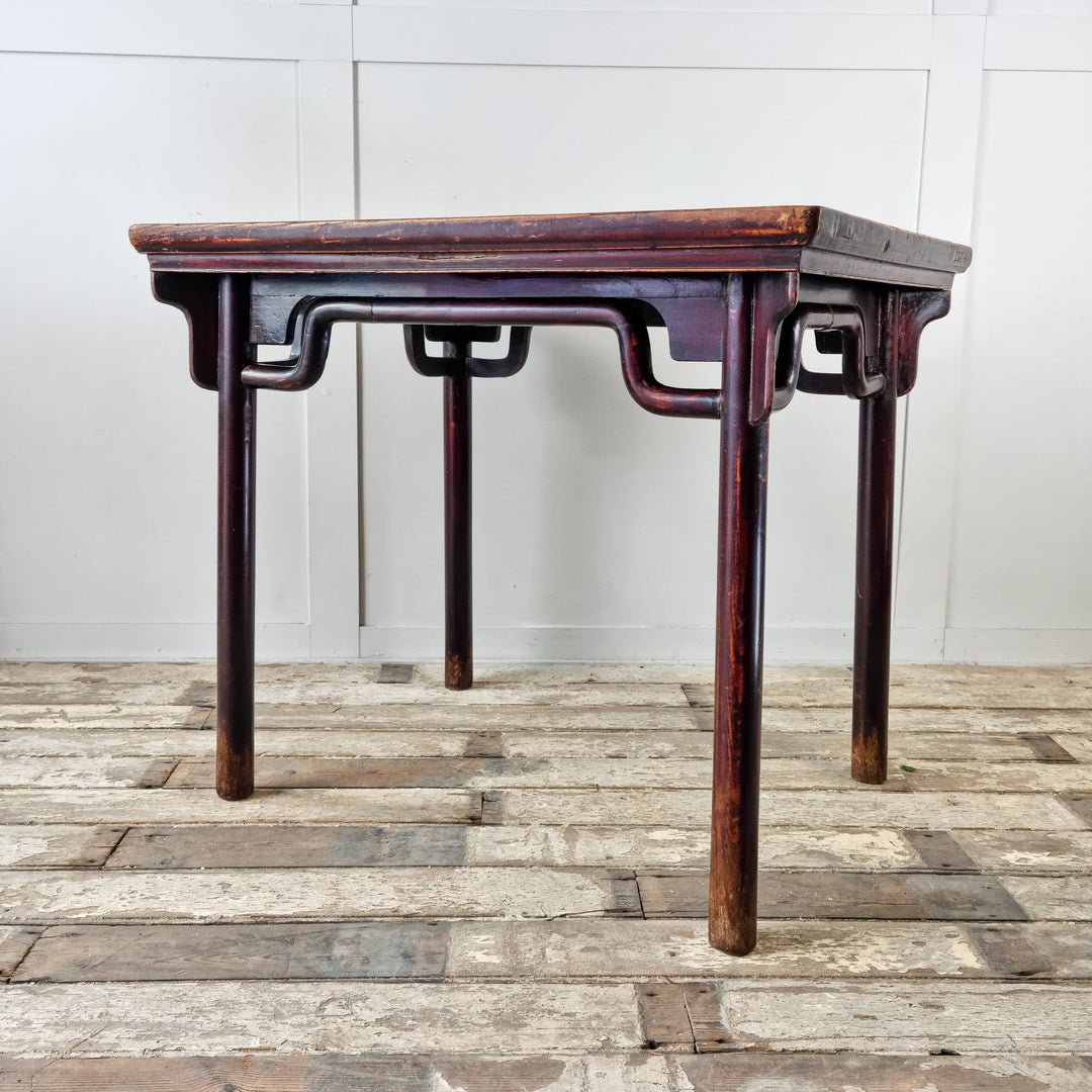 Antique Chinese table with deep burgundy lacquered finish
