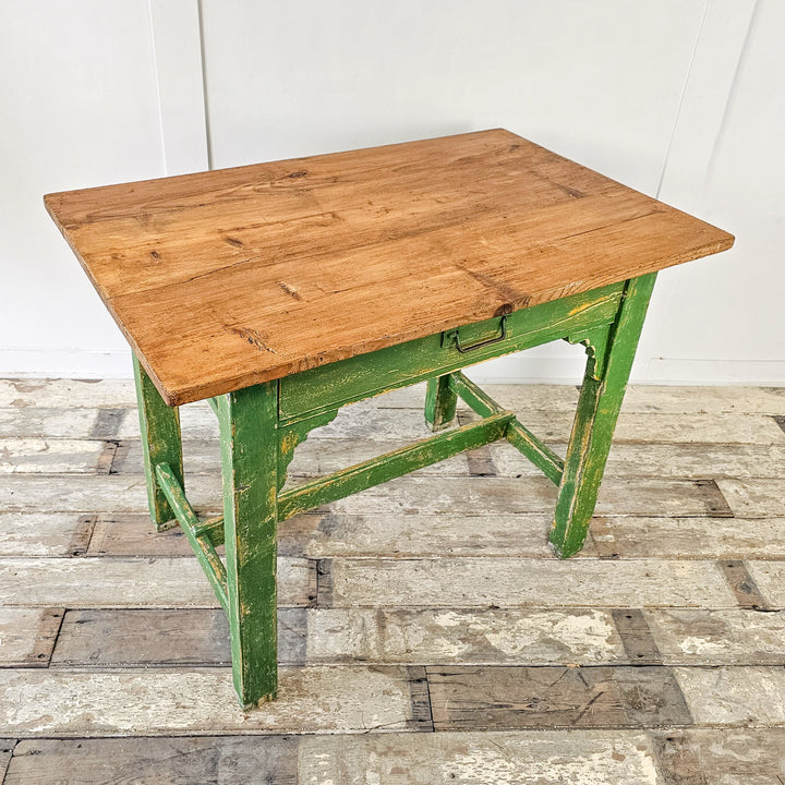 A small antique pine prep table from the early 20th century with green painted base and waxed pine top - View from the Top showcasing the warm pine tones