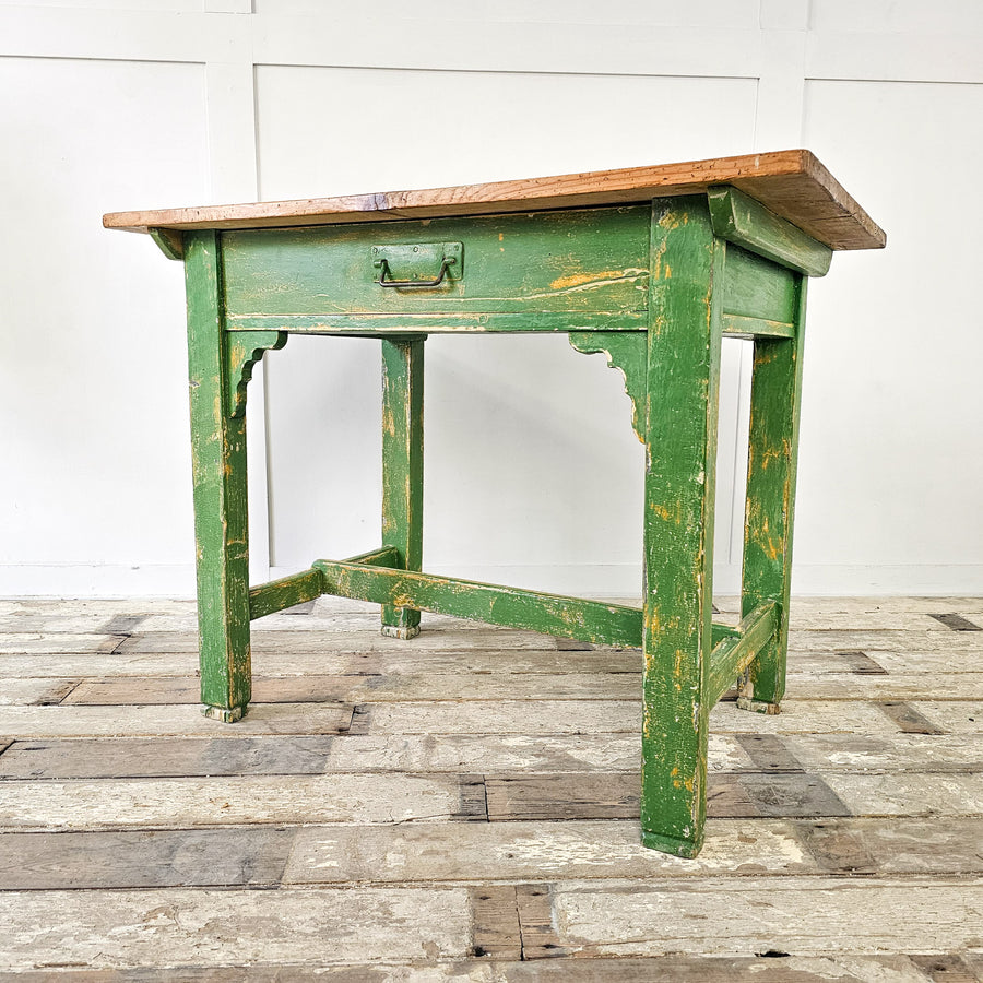 A small antique pine prep table from the early 20th century with green painted base and waxed pine top - Angled View