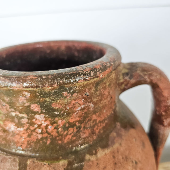Vintage glazed Turkish pot with olive green rim, handles, and drainage hole. Perfect for flowers or as decor.