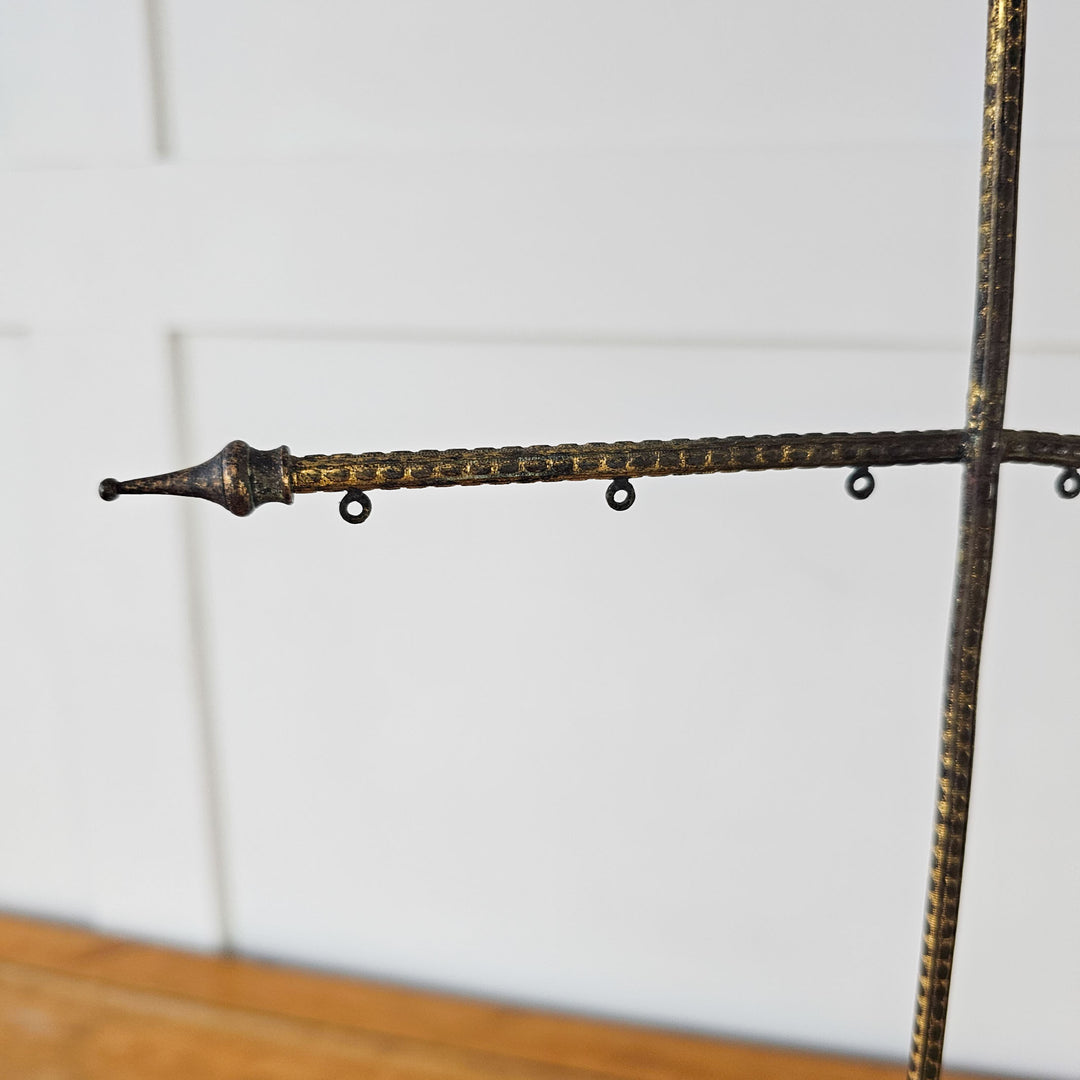 Victorian-era banner stands with brass cross design and porcelain handles
