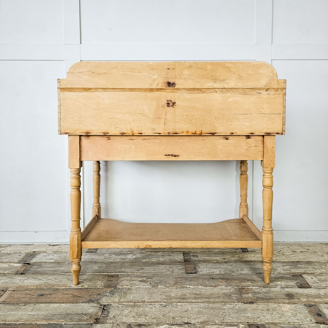 Victorian-era washstand with rustic appeal and elegant silhouette