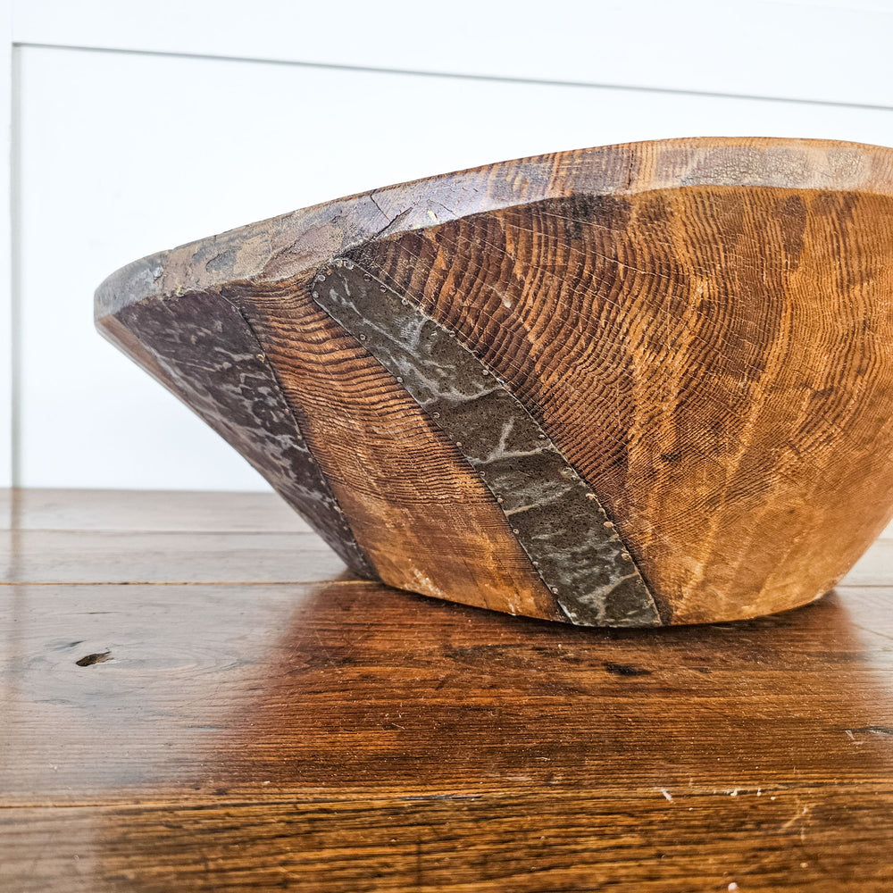 Vintage wooden dough bowl showing authentic patina and character.