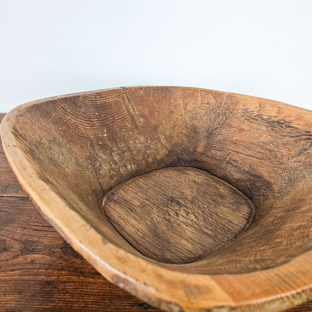 Vintage dough bowl, adding warmth and character to any space.