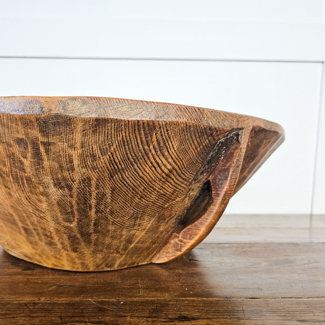 Rustic wooden bowl, a conversation starter in any room.