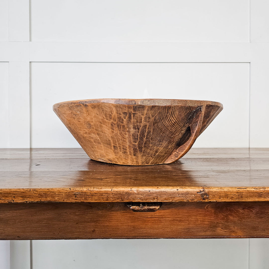 Antique dough bowl, a blend of history and functionality."