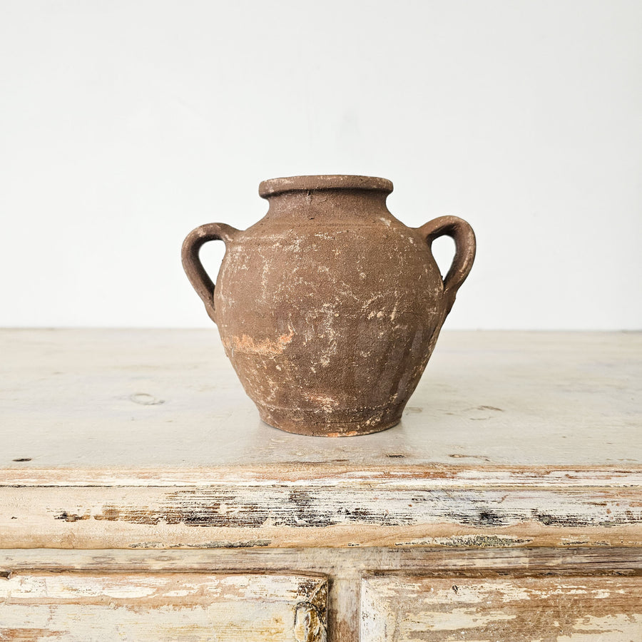 Handcrafted Turkish earthenware pot with two handles. Rustic décor accent ideal for dried flower arrangements.