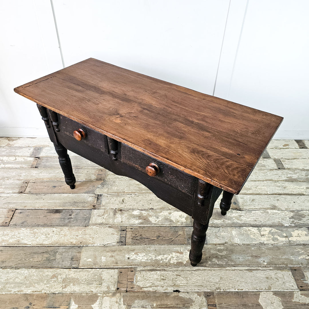 Vintage side table boasting original black painted base.