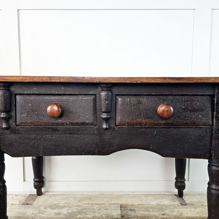 Vintage console featuring classic turned leg details.