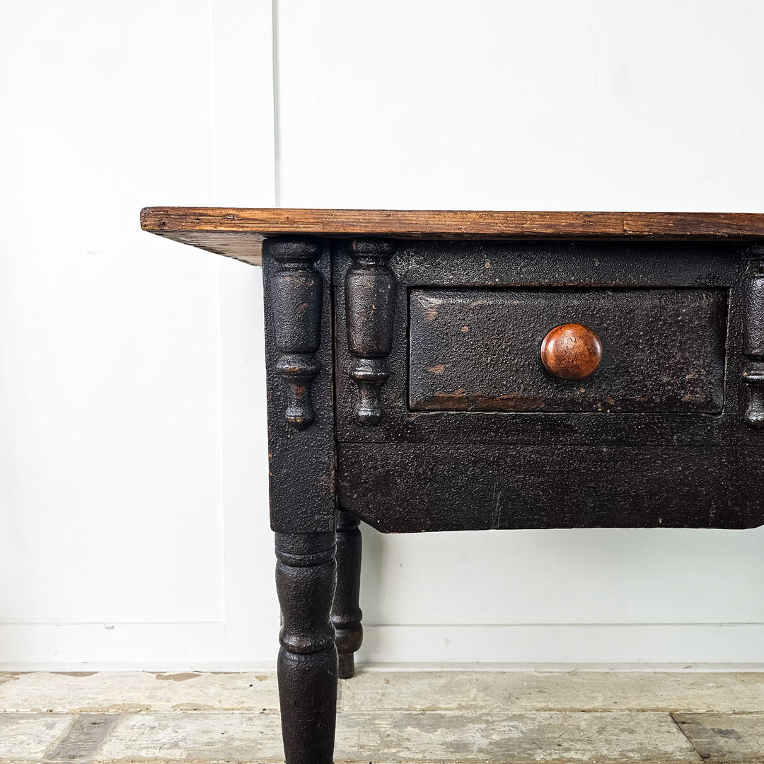 Antique side table with practical storage and vintage charm.