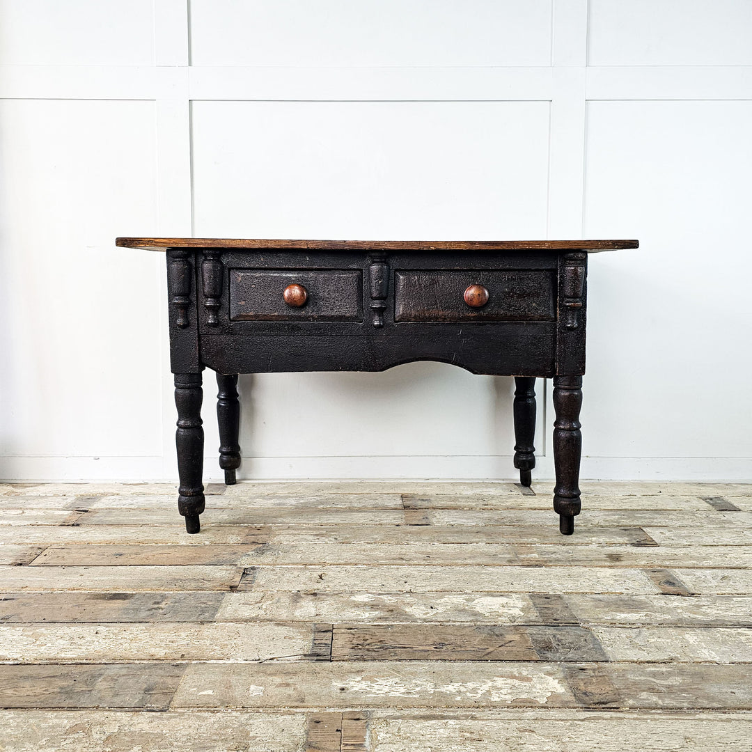 Estate-made console featuring charming asymmetrical design.