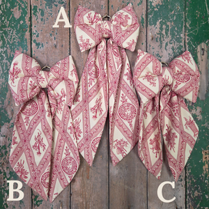 Handmade Country House Bow from vintage fabric, with a lightly structured body and gently tapering tails. Complete with brass hanging hoop, perfect for farmhouse interiors or as a decorative home accent.