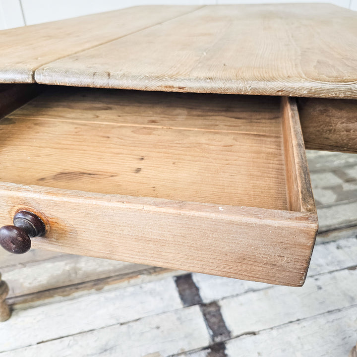 Pine farmhouse table with classic charm and character, internal drawer view