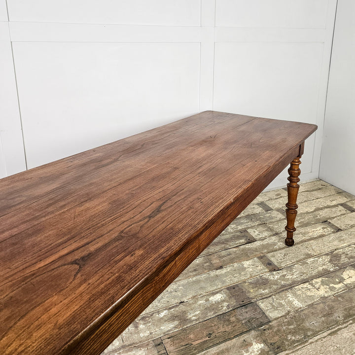 19th century French farmhouse table in elm and fruitwood with practical planked top
