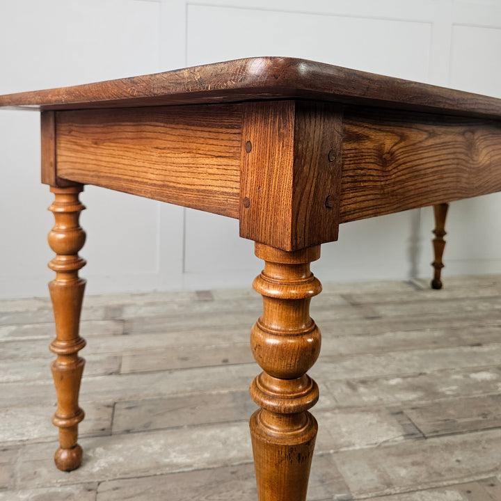 Traditional farmhouse dining table with planked elm top and fruitwood base, seats six to eight
