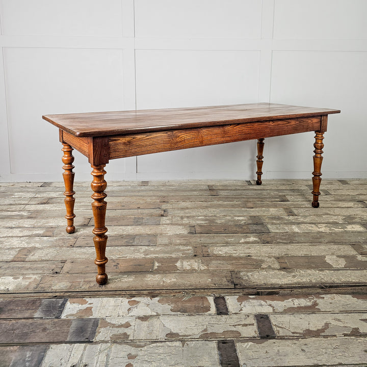 Antique elm dining table with fruitwood legs and a wide planked surface, ideal for everyday use

