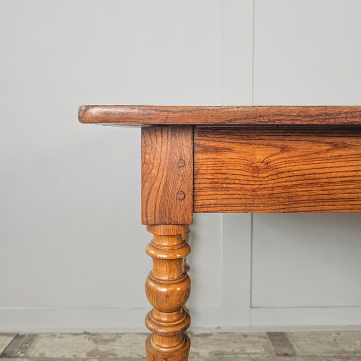 French kitchen table with shaped fruitwood legs and planked elm top, made in 19th century France

