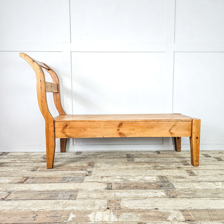 Vintage French sleigh bench with antique pine wax finish.
