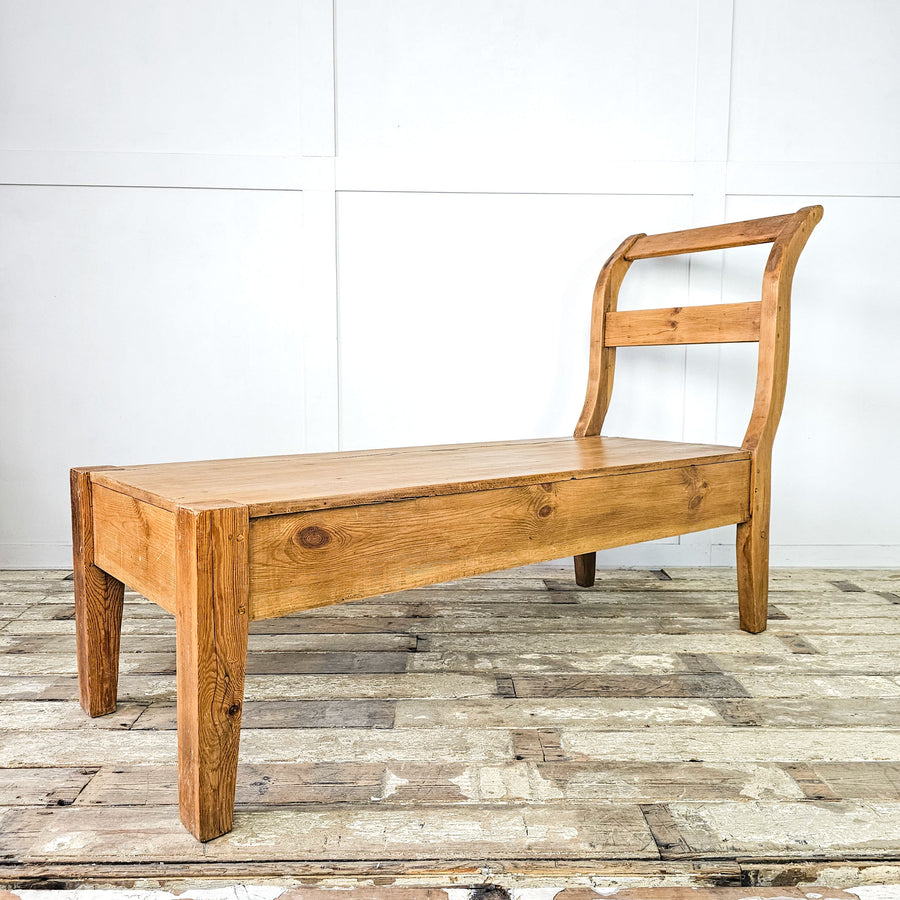 Vintage pine bench with backrest for boot rooms.
