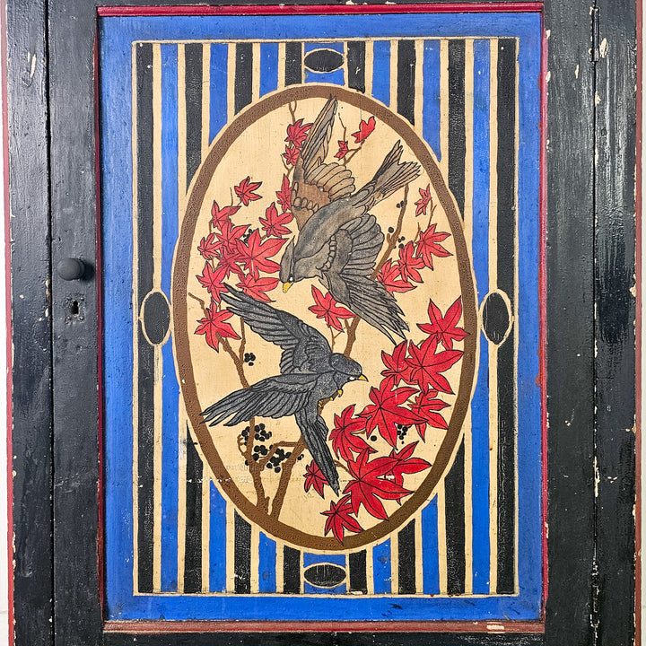 Rustic French painted cupboard with folk art style 
