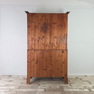 Antique English oak Pantry Cupboard with internal shelving, panelled doors and a base section with two short drawers over two full-width drawers.