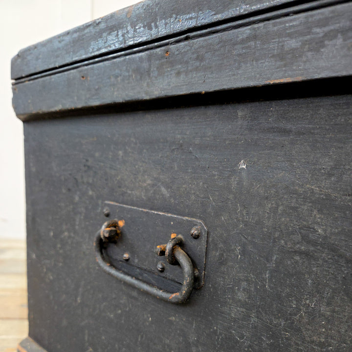 A Victorian blanket box with carrying handles and hinged lid, offering useful storage and decorative appeal.