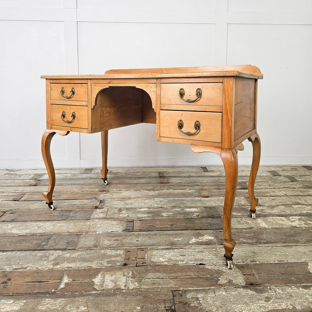 Early 20th century country pine writing desk with castors
