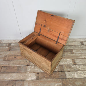 An antique Victorian pine storage chest with a traditional chest form, hinged lid, and original scumble-painted finish. This cottage style pine chest is suitable for hallway storage or placement at the foot of a bed.