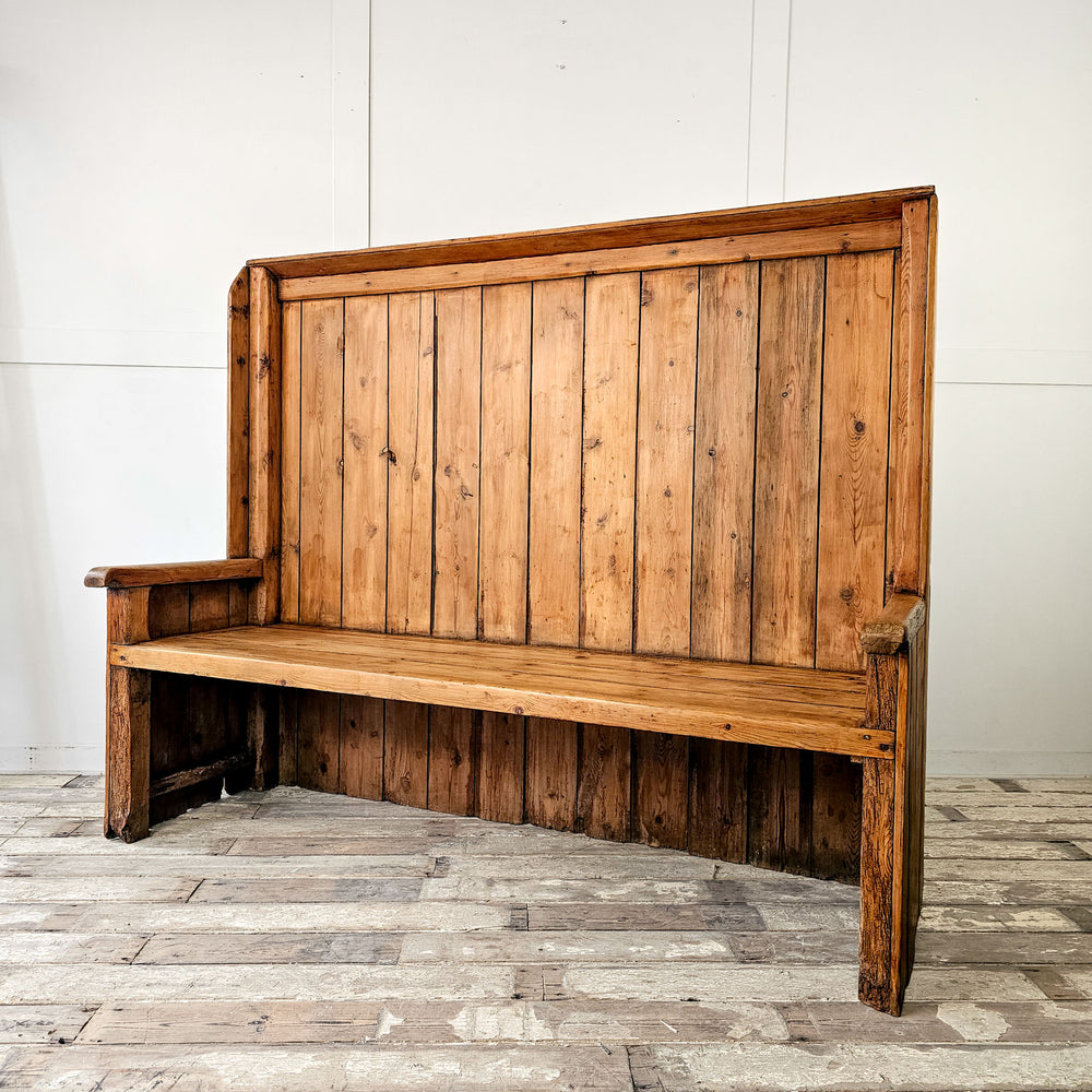 Antique pine settle with high back
