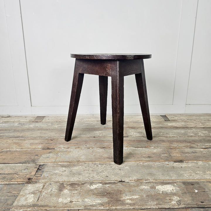 Low antique oak stools with decorative seat detailing and practical flat surfaces
