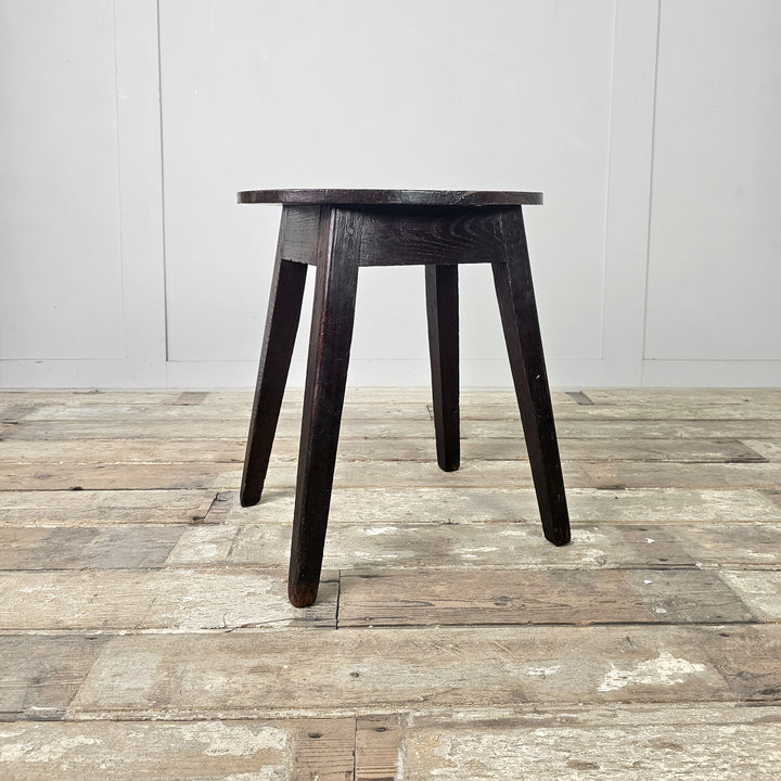 Farmhouse-style antique stools with characterful oak grain and comfortable proportions
