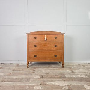 Antique oak chest of drawers by Waring and Gillow of Liverpool, circa 1920 to 1930, with oval brass ring pulls
