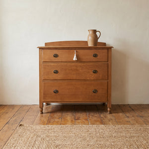 Antique oak chest of drawers with two short over two long graduating drawers and Waring and Gillow Liverpool stamp
