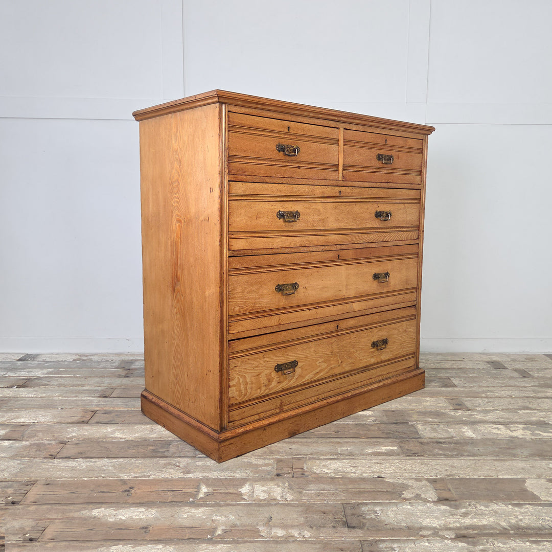 Golden patina Victorian ash chest of drawers, five drawers with reeded detailing, original brass drop handles, and classic late-19th century craftsmanship.