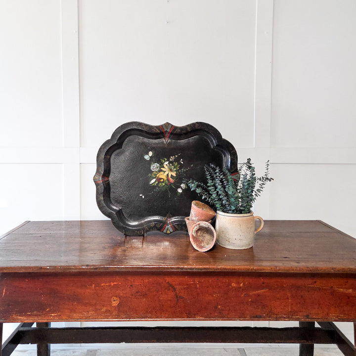 An antique Victorian papier-mâché tray with hand-painted floral design and mother-of-pearl detail on a black lacquer ground, perfect as a decorative serving tray, console table display piece or wall-mounted accent in a traditional interior.