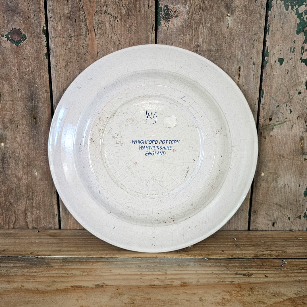 Glazed pottery plate with floral design

