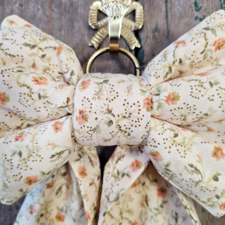 Decorative country house bow in cream vintage fabric
