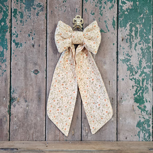 Vintage fabric bow with small rosebud print
