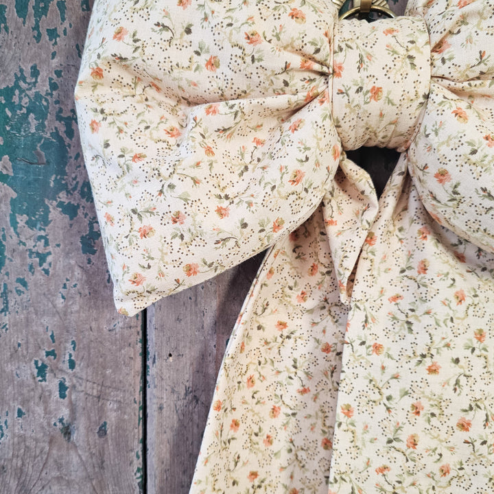 Padded decorative bow with ditsy floral design
