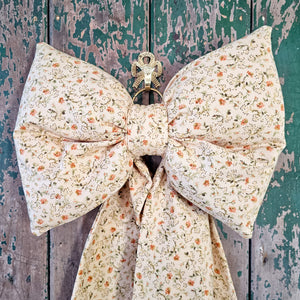 Small floral padded bow with velvet detail
