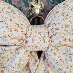 Tapered bow in antique-inspired floral fabric
