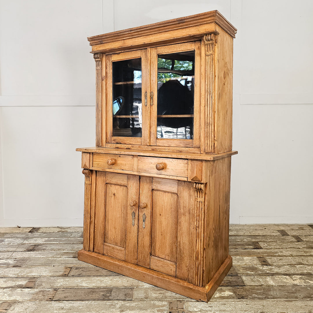 Antique pine display cabinet with glazed doors