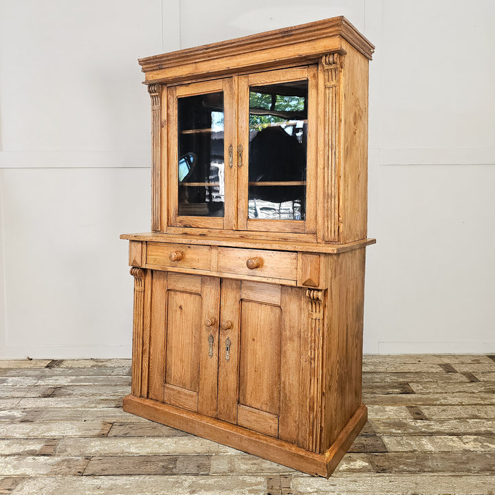 Antique pine display cabinet with glazed doors