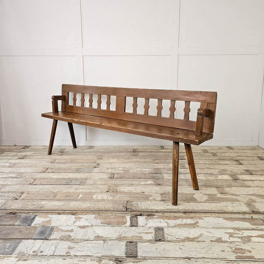 Antique hall bench with slatted back and stick legs