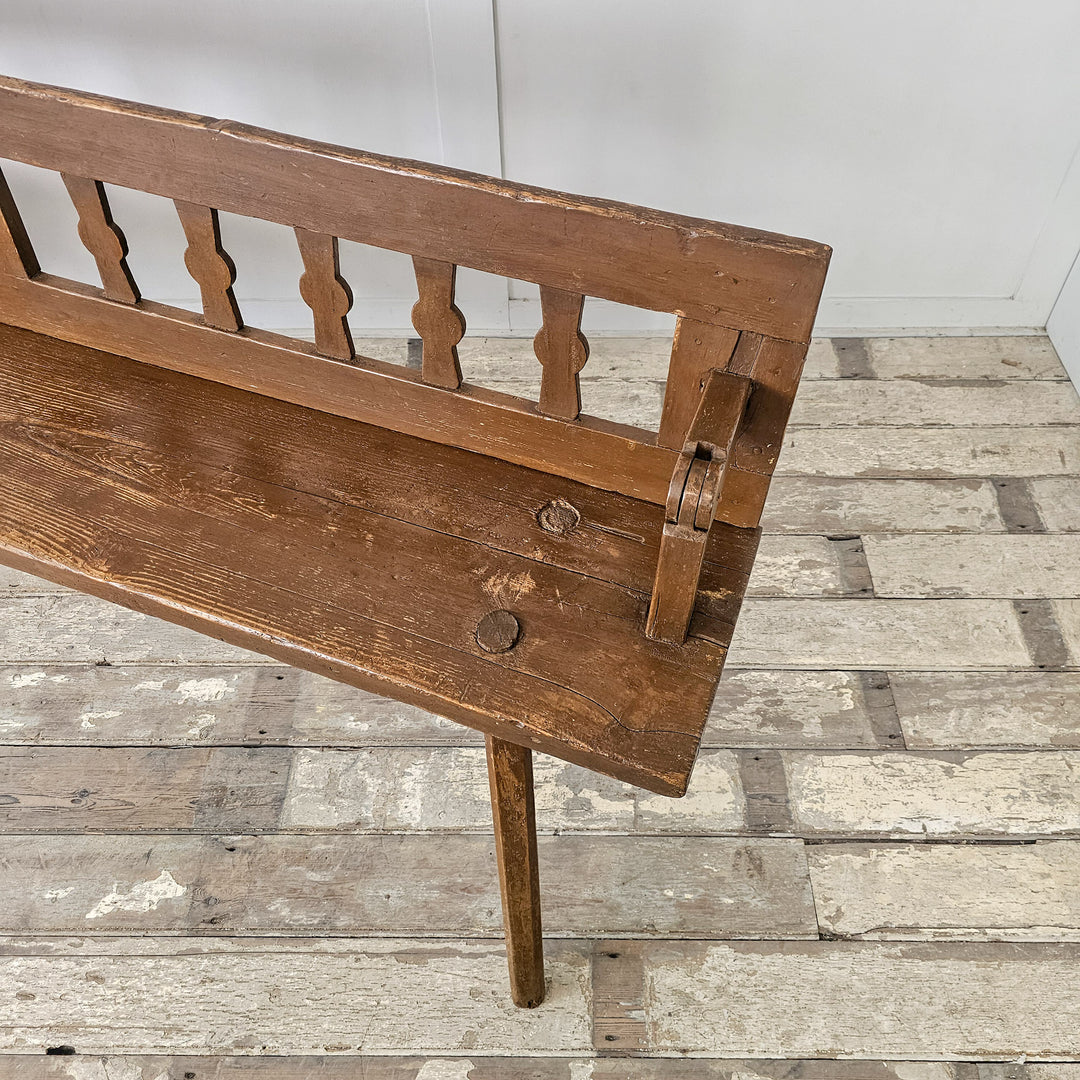 Pine bench with flip-backrest and rustic frame