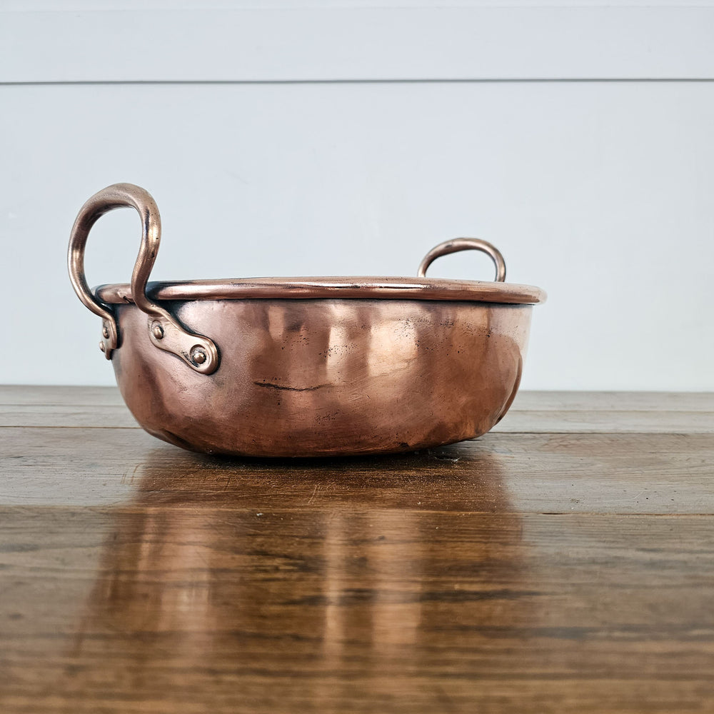 Antique farmhouse-style copper pan.