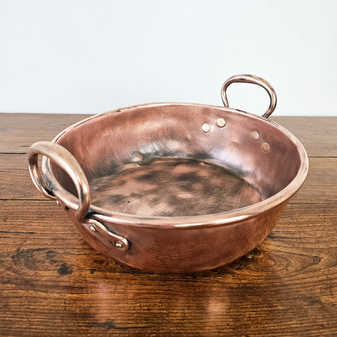 Vintage copper pan ideal for planters or fruit display.
