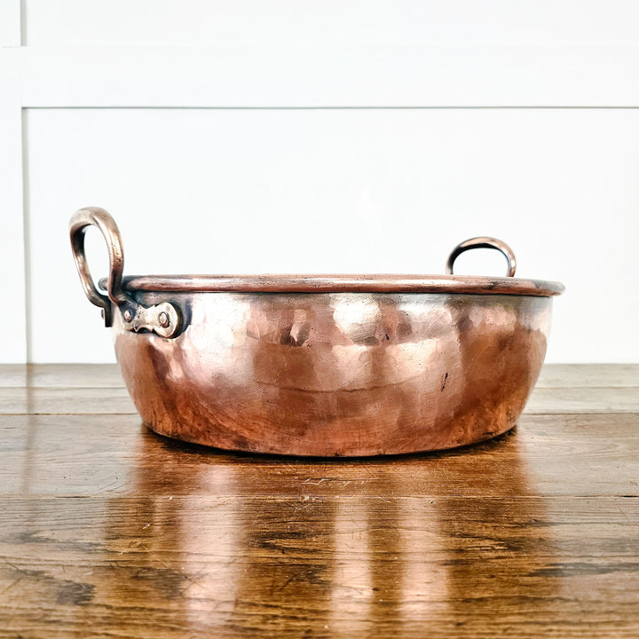 Rustic antique copper pan, perfect for decorative displays.