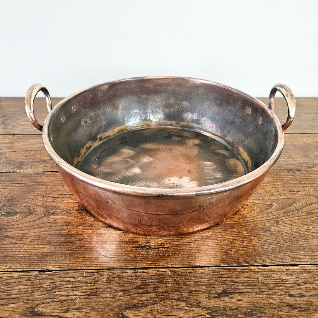 Victorian copper pan, sturdy construction, water-tight design.